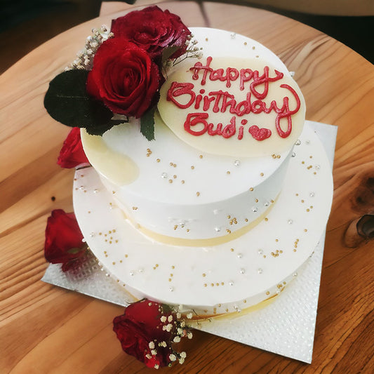 Double Tier Cake Adorned with Gold Ribbon and Rose decoration